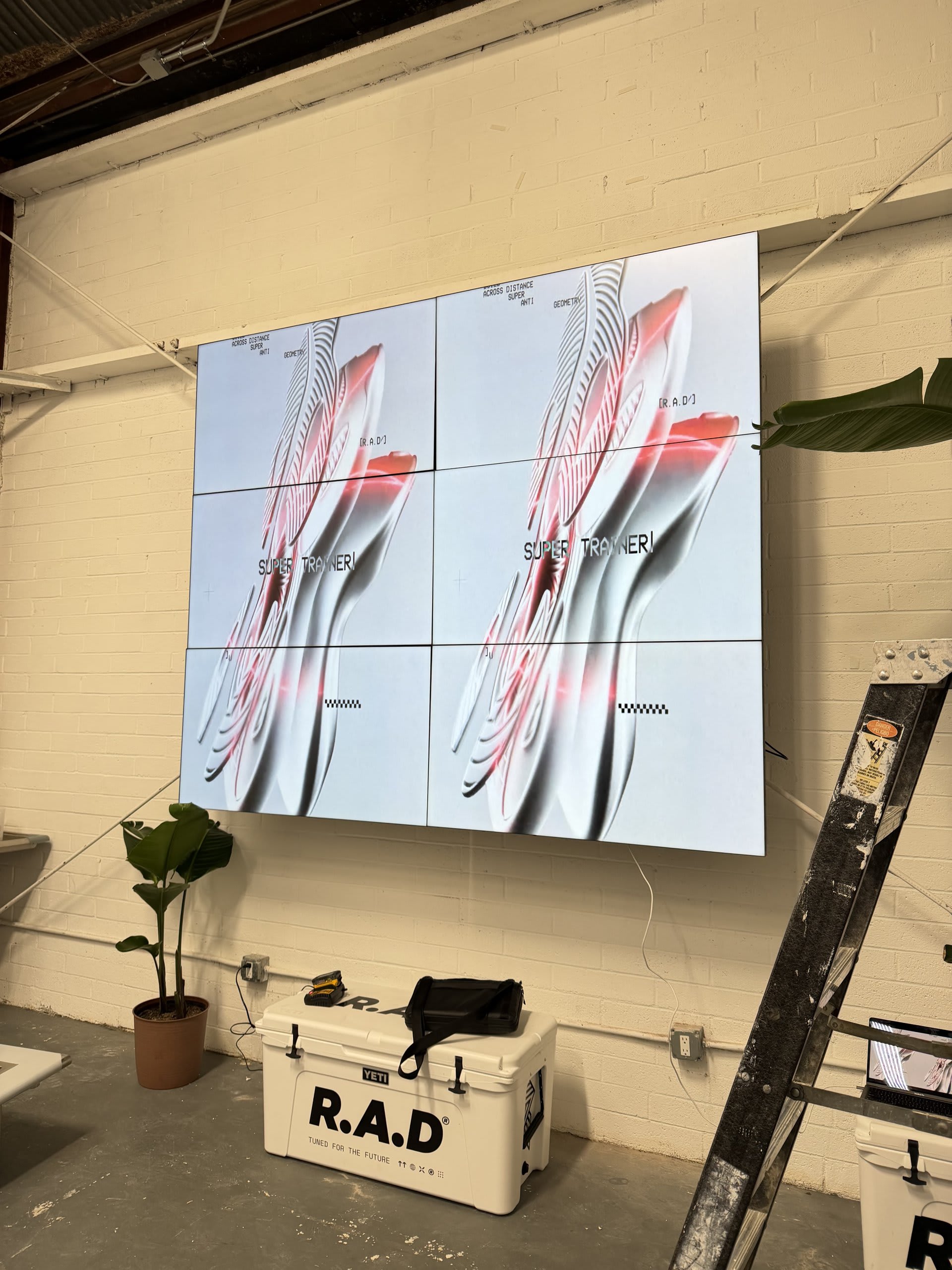 Commercial LED video wall built from tiled panels showing branded content — Ermine Smart Home, Los Angeles