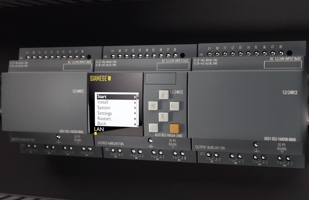 Wide-angle 3D render of 'Siamese PLC' modular control system featuring multiple interconnected units with a touchscreen interface, system status menu displayed, and various input/output terminal blocks.