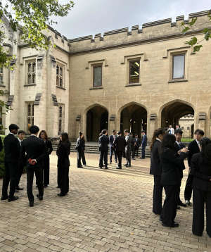 Group of friends socialising in a dimly lit bar or lounge