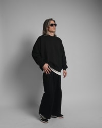 365.APParel Oversize Sweatshirt Black — man, full body three-quarter side view, sunglasses, long silver hair, hand on hip, studio