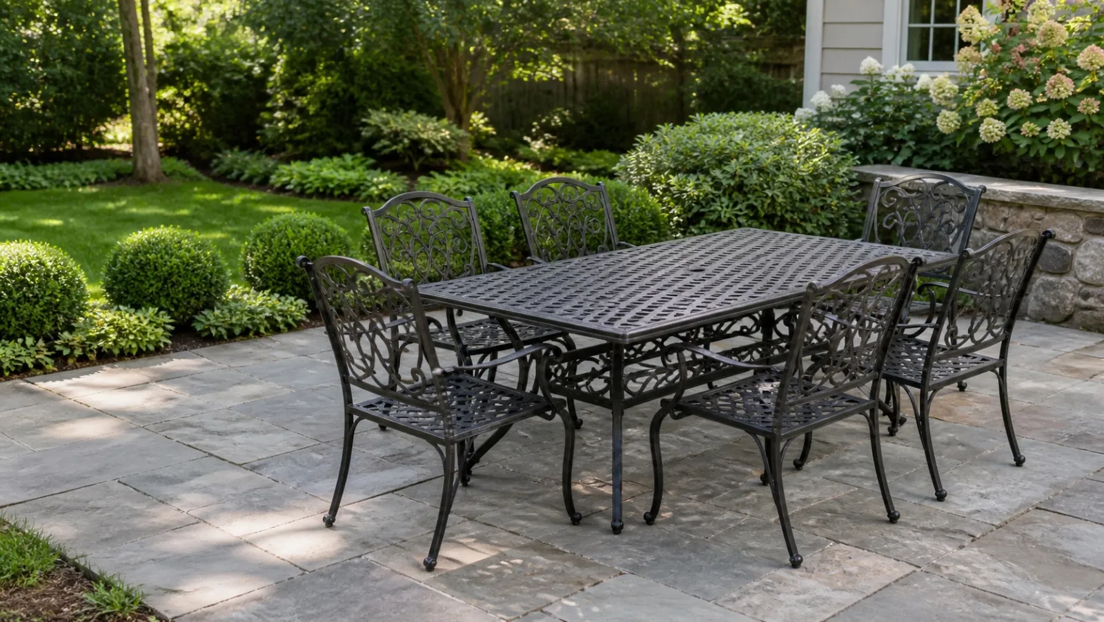 A restored metal patio dining set on a New Jersey residential patio