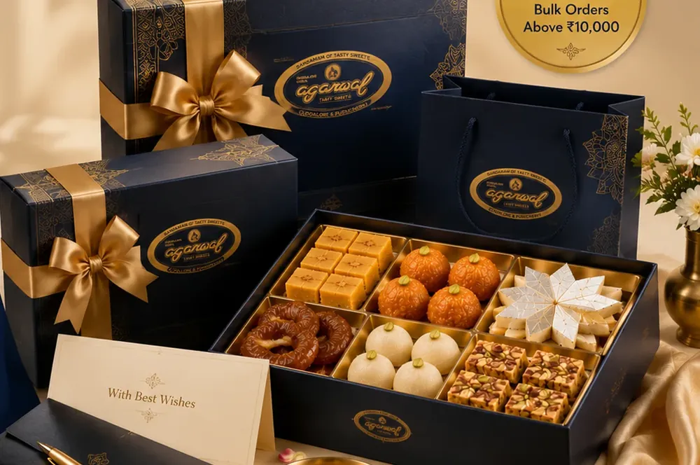 Navy and gold Agarwal corporate gift boxes with a printed greeting card