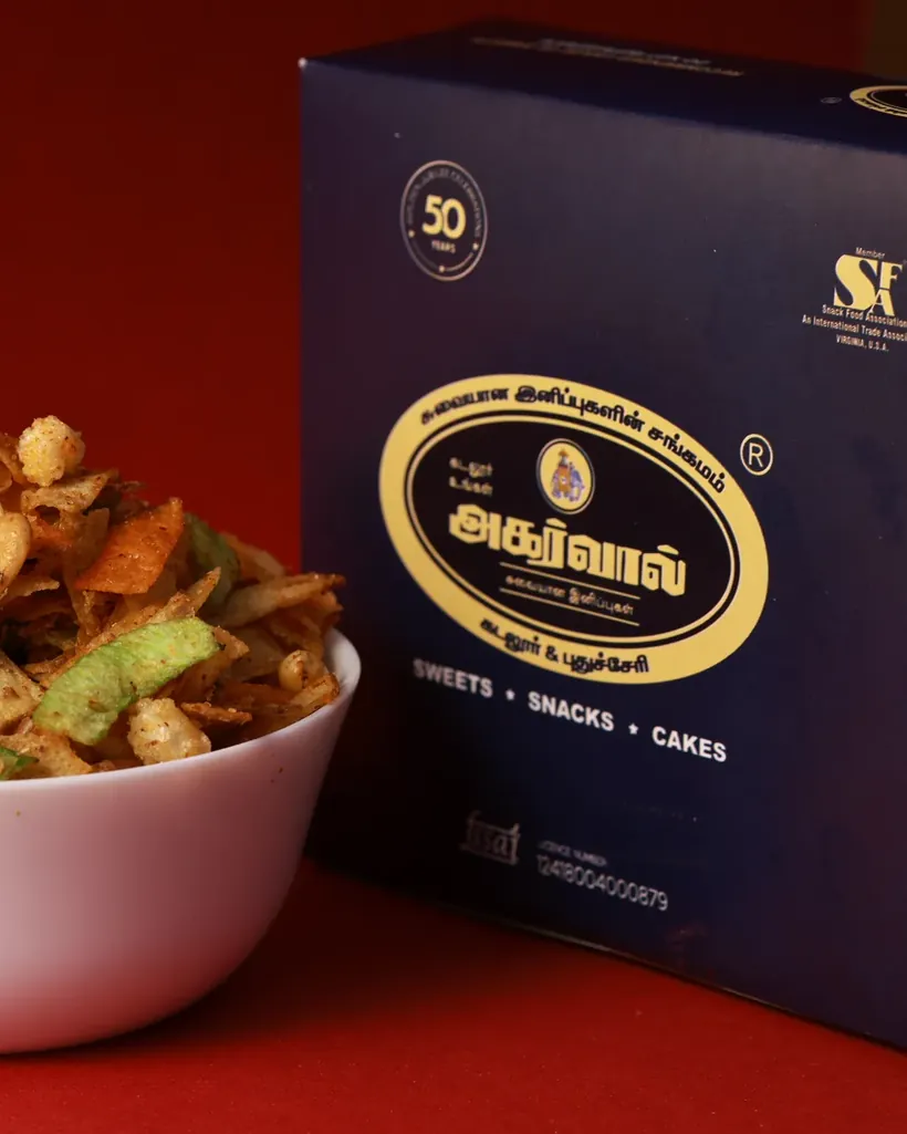An Agarwal gift carton beside a bowl of freshly made mixture