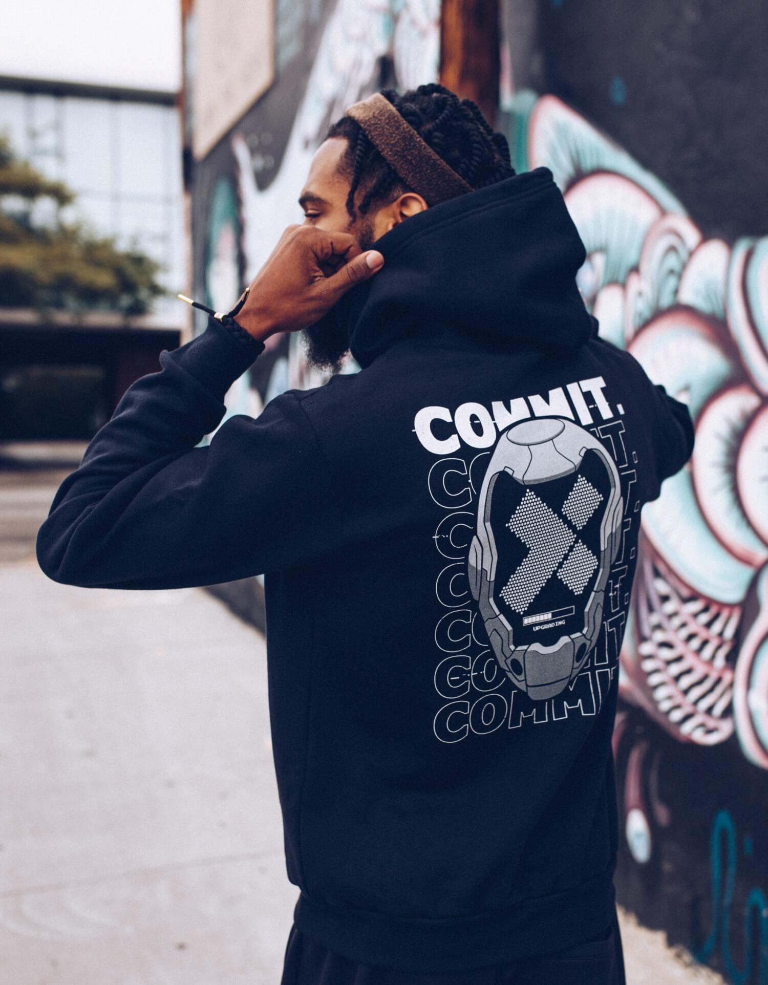 Hoodie with the X-Team logo inside a Daft Punk-esque mask in front of the words COMMIT.