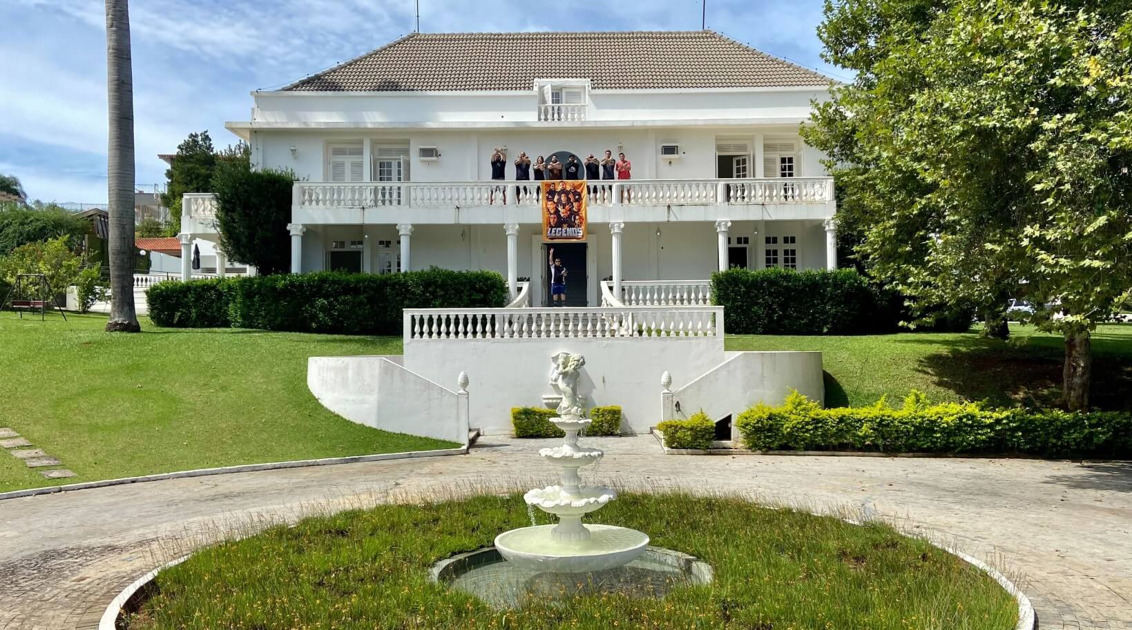 X-Teamers standing on a balcony of a gigantic mansion