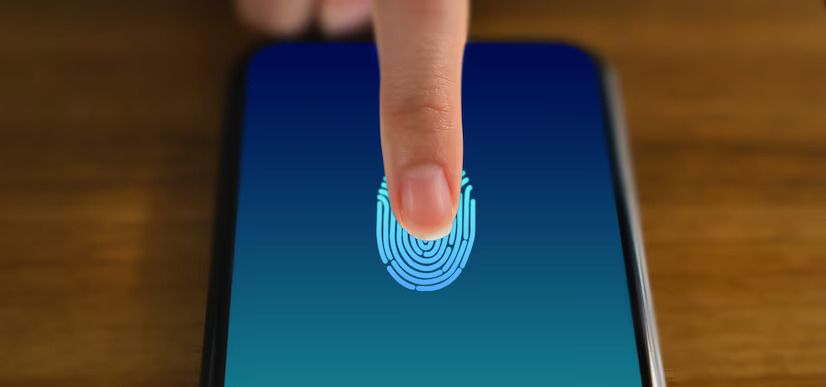 The image shows a person using a fingerprint scanner on a smartphone for biometric authentication.