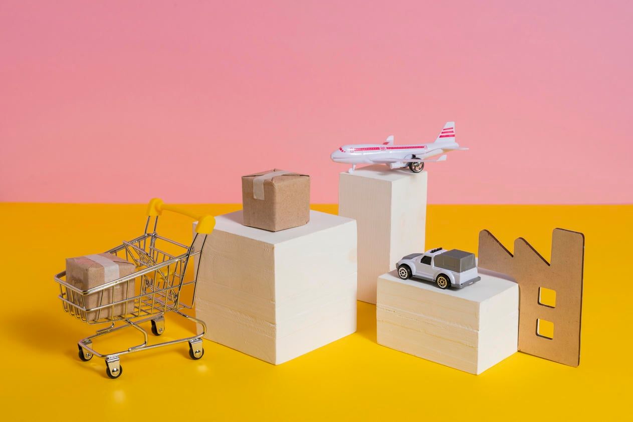 This image represents a simplified supply chain with a toy airplane, car, and shopping cart, highlighting different logistics modes.