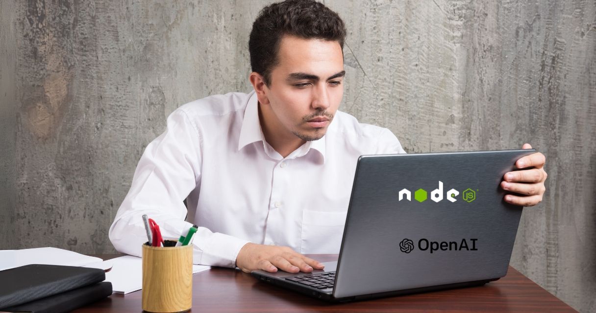Businessman looking into laptop and sitting at the desk. High quality photo