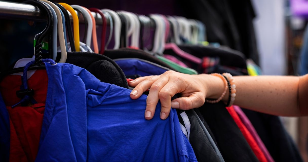 Side view hand holding jacket