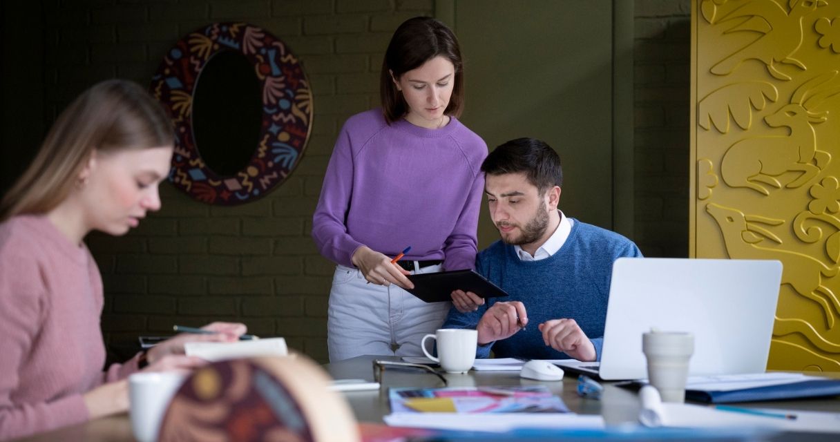 Medium shot people working at office