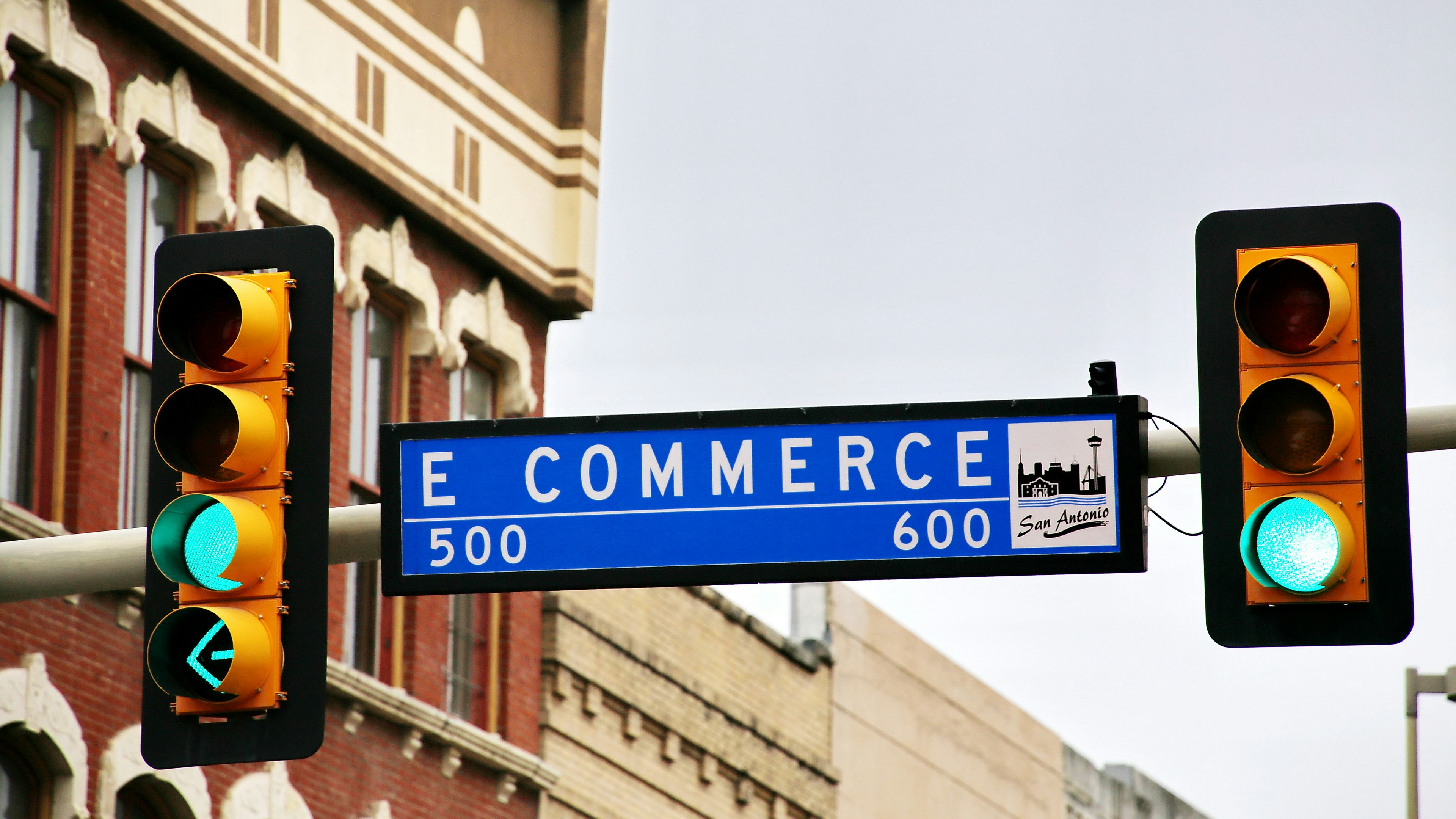 A street sign and traffic light at a road intersection representing the forced decision brands face with Hydrogen 3.0