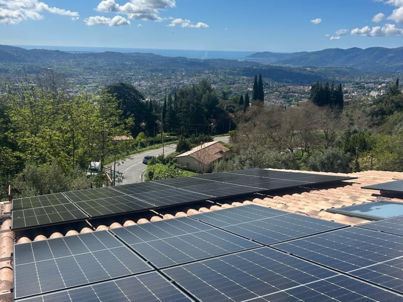 Solar PV panels installed on a residential roof alongside a Teratherm surface thermal system