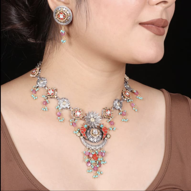 Model wearing handcrafted 925 silver hoop earrings