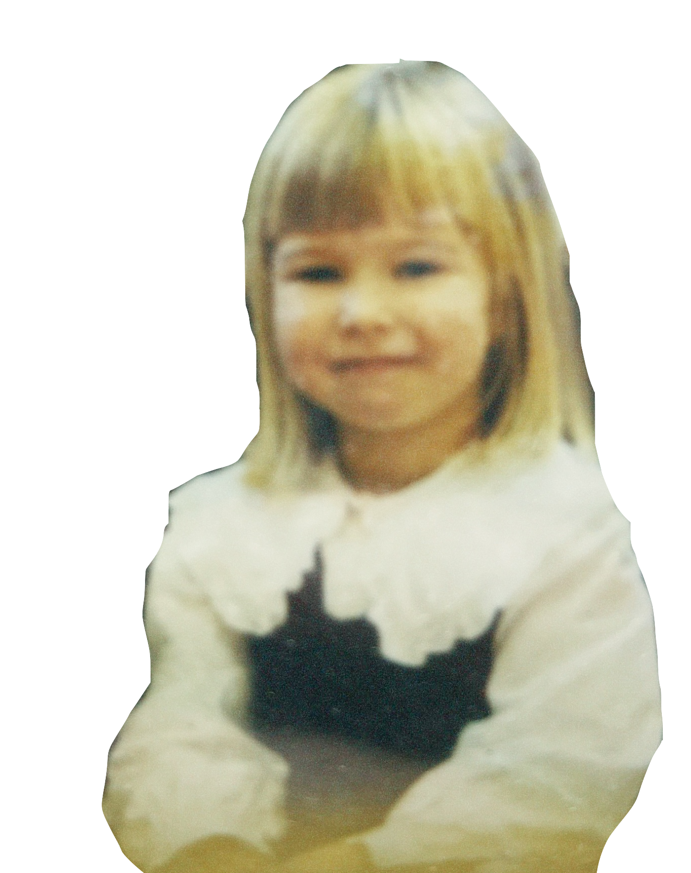 Caroline posing for a photo in her school uniform