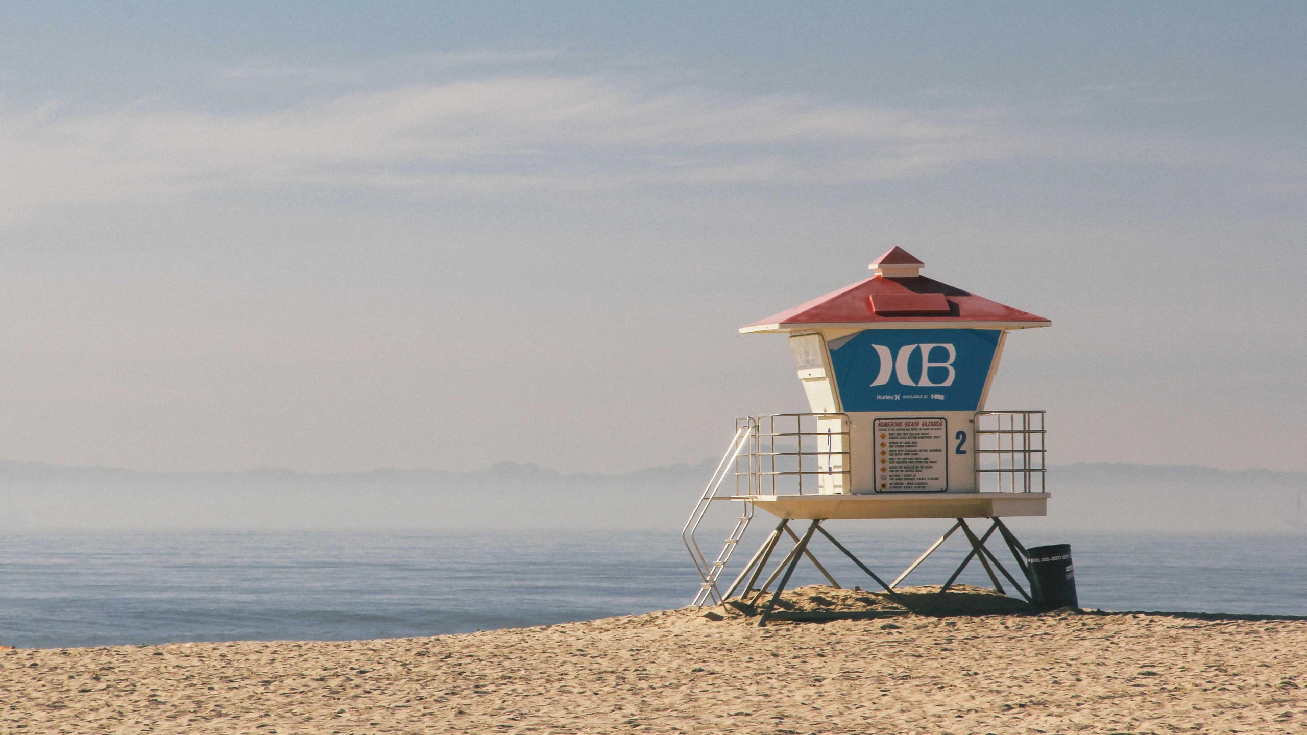 A pastel lifeguard tower on the sand