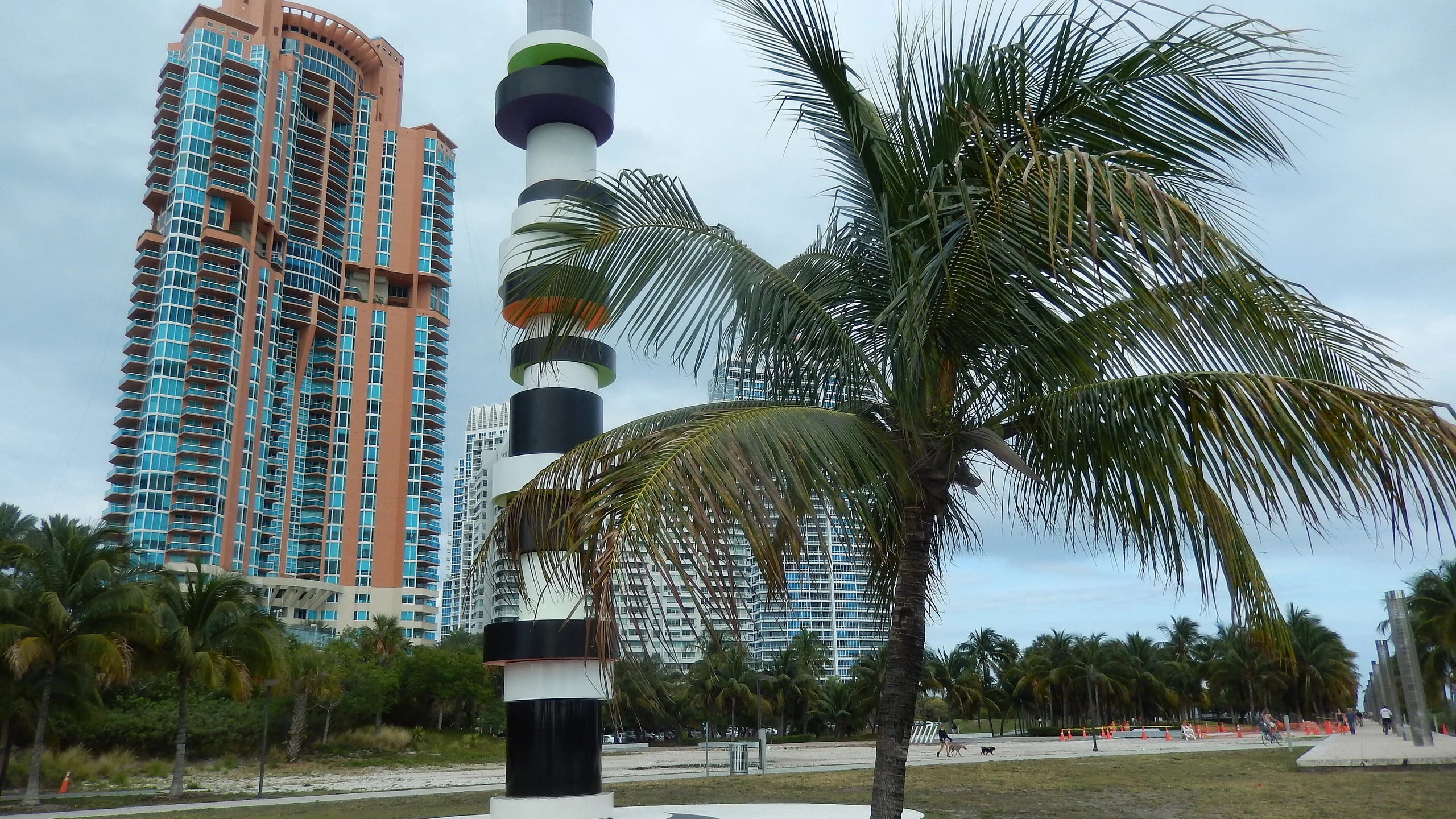 A striped tower and a palm tree in South Pointe Park