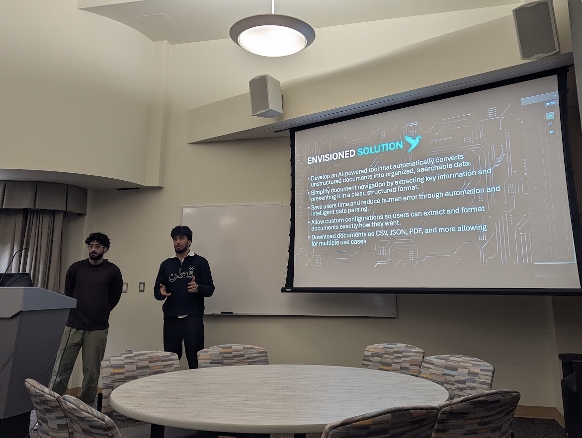 Ibrahim and Affan presenting at GDG Windsor DevFest 2025