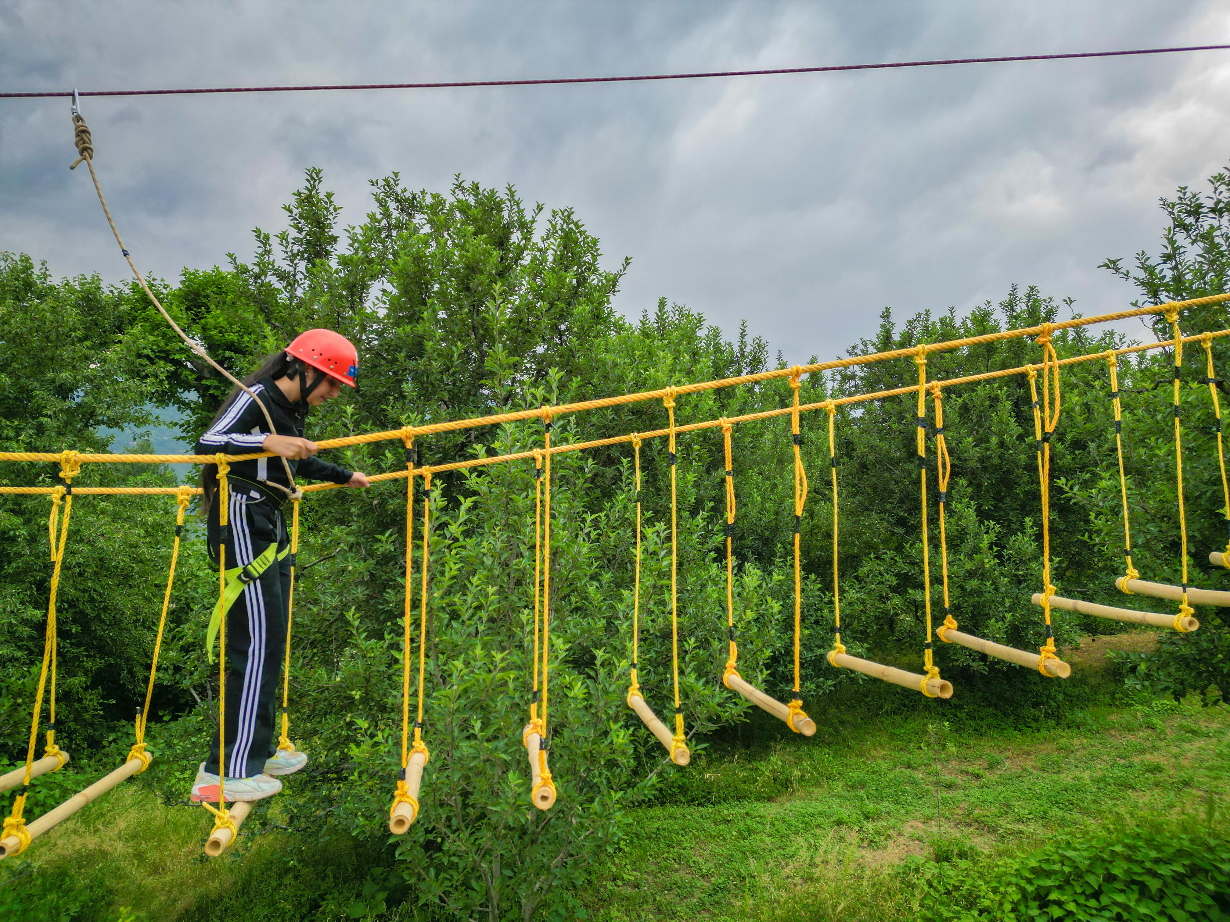 Group trekking through a lush mountain trail