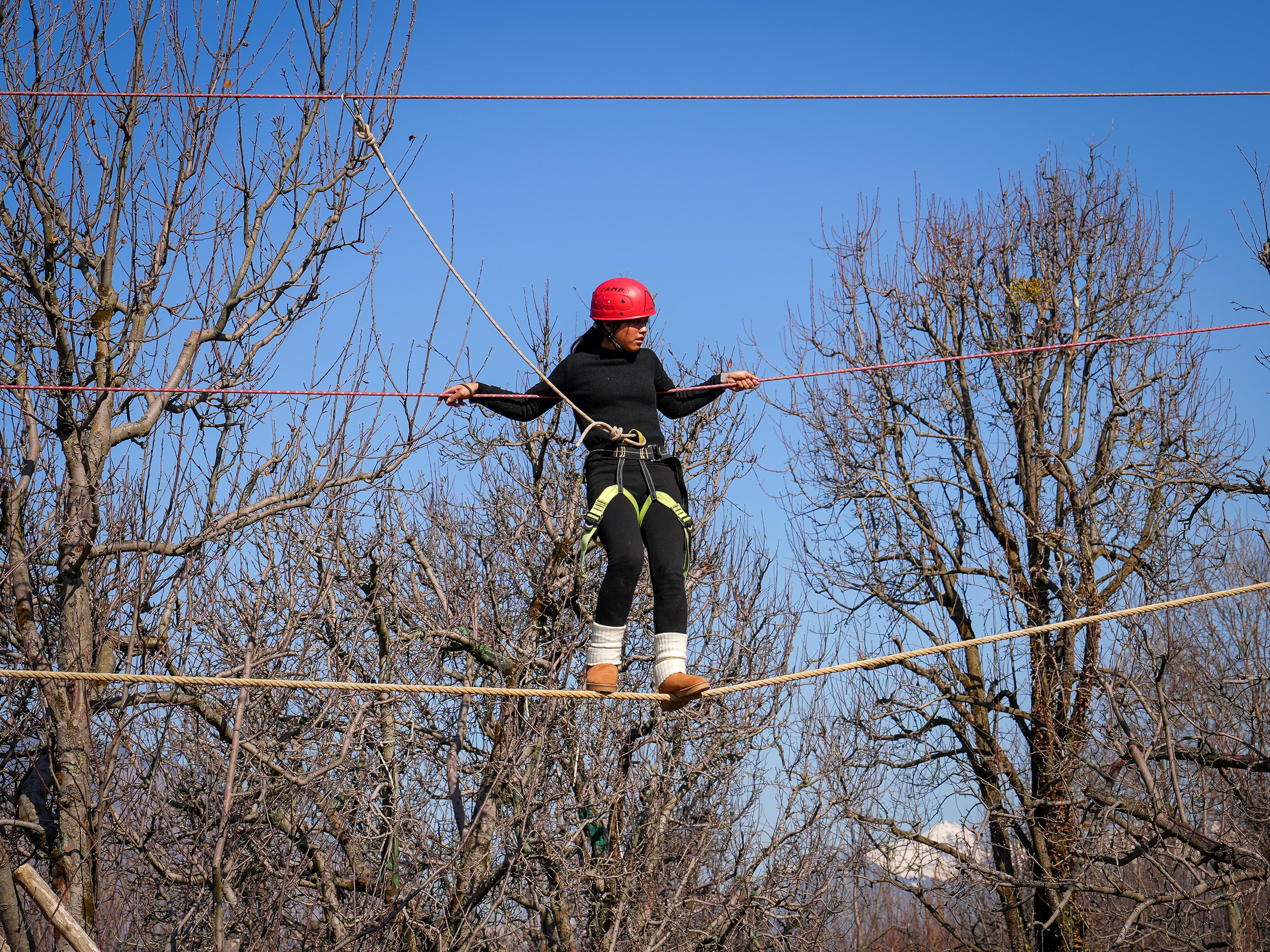 Rock climbing a steep cliff face