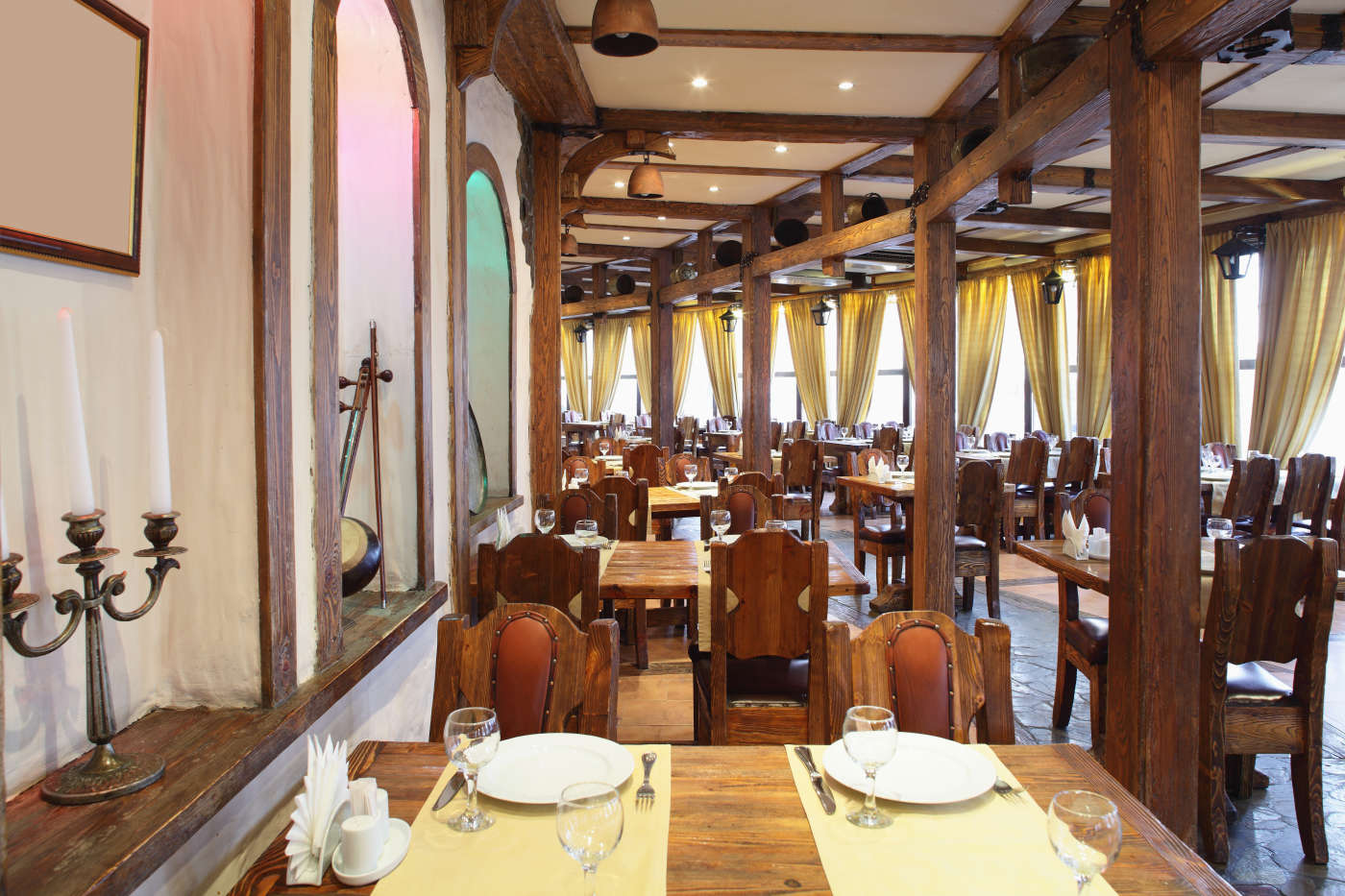 Interior of Gogung dining room with wooden screens and warm lighting