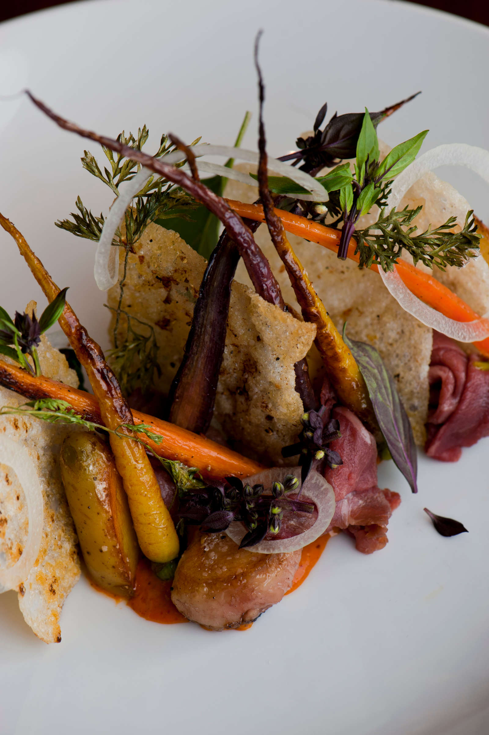 A plate of roasted carrots with bone marrow