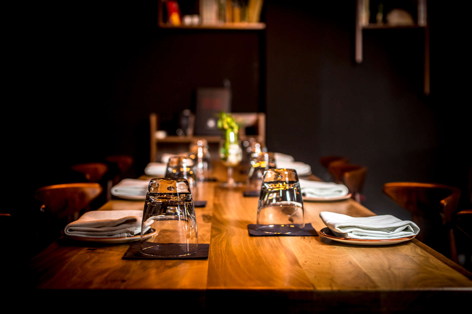 The dim wood-and-paper dining room at Hanok Table