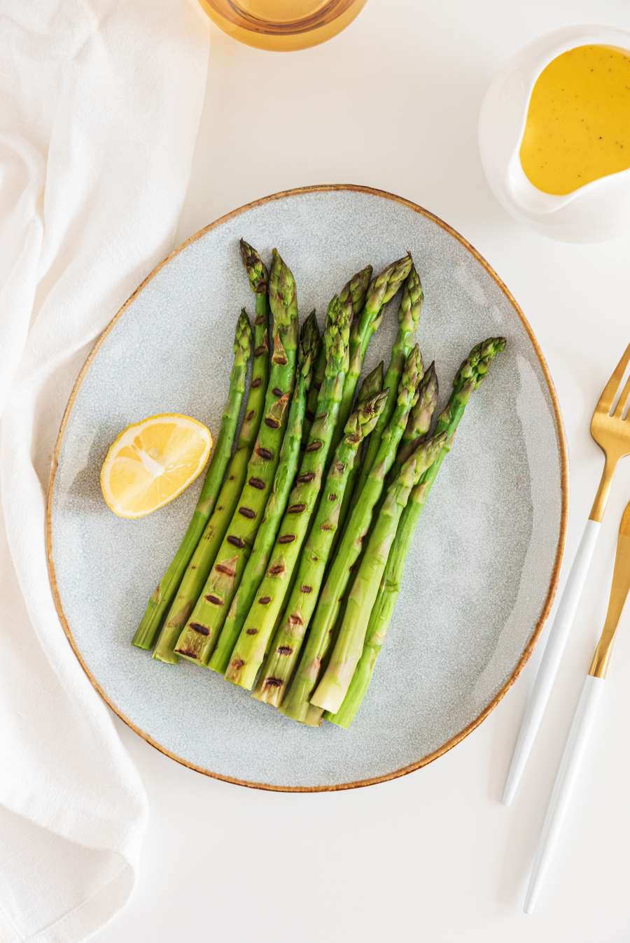 Charred spring asparagus on a small plate