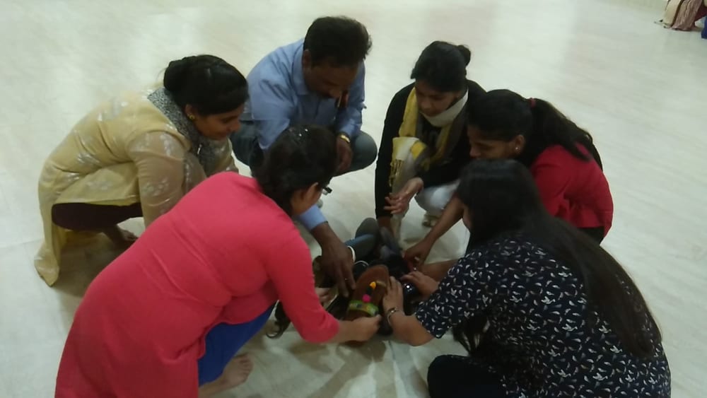 Workshop demonstration with teachers practicing techniques