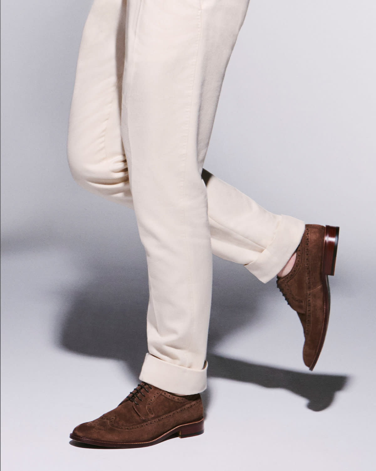 Close up of Kai in our brown suede Superior brogues