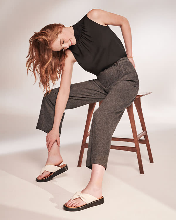 Model wearing Landmark sandals
