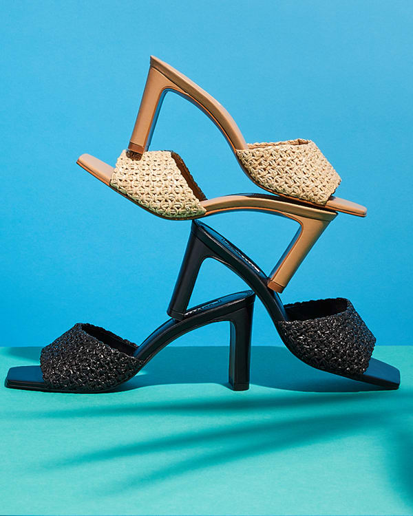 Pairs of the March raffia mules stacked on one another