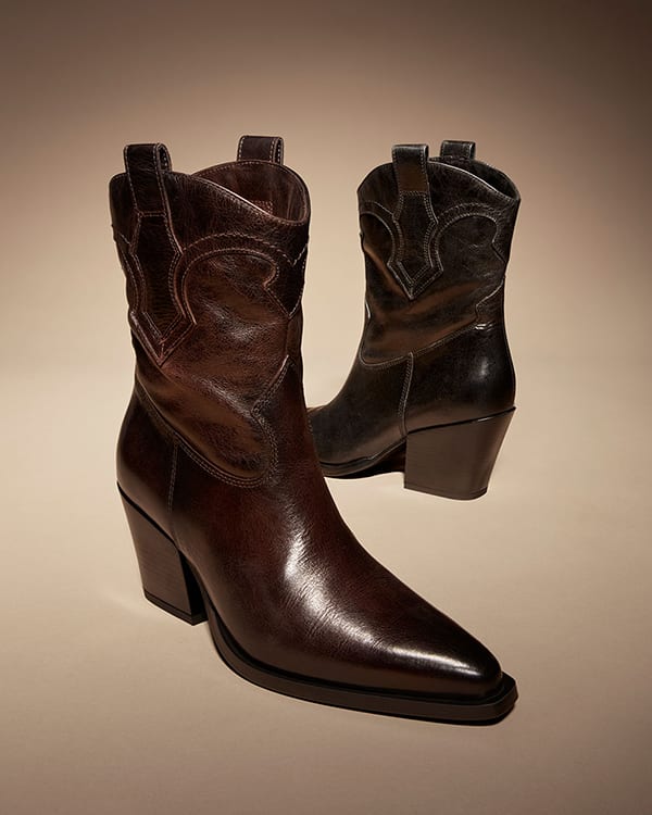 Women’s brown heeled cowboy boots.