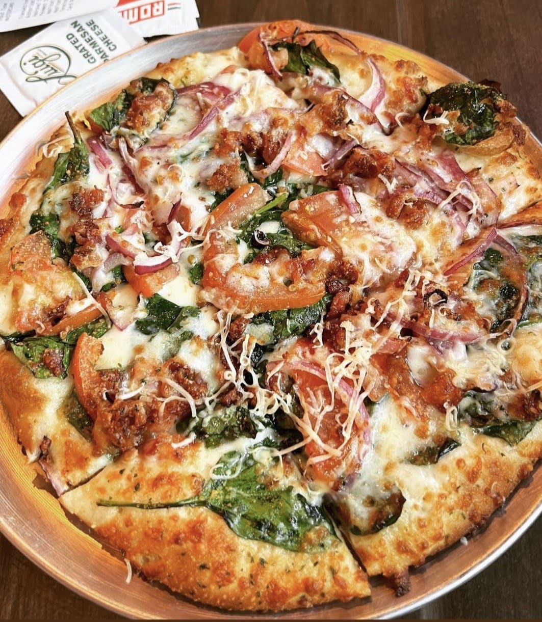 Pizza being prepared at Crust Pizza Co. Alden Bridge, The Woodlands, TX