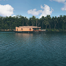Alleppey Backwaters' Scenic Houseboat Cruises and Greenery