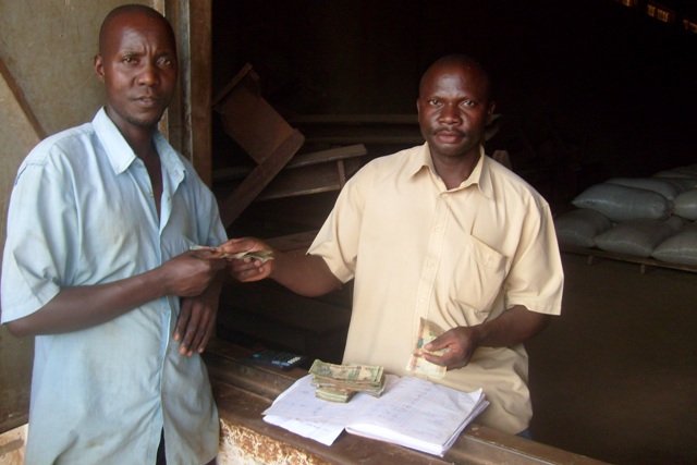 Farmer with fresh harvest in Nakigo Sub-county