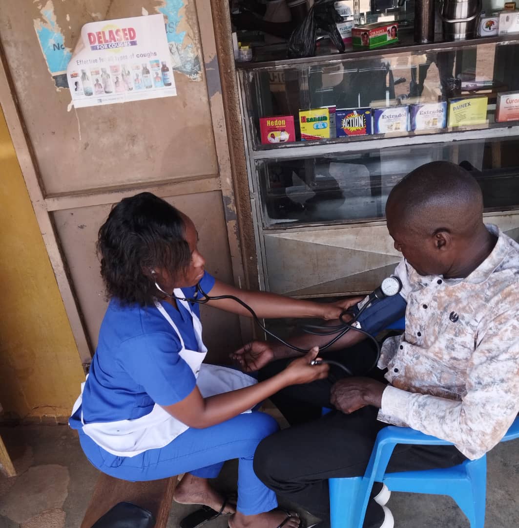 Community health worker with a patient at Sanford Health Centre