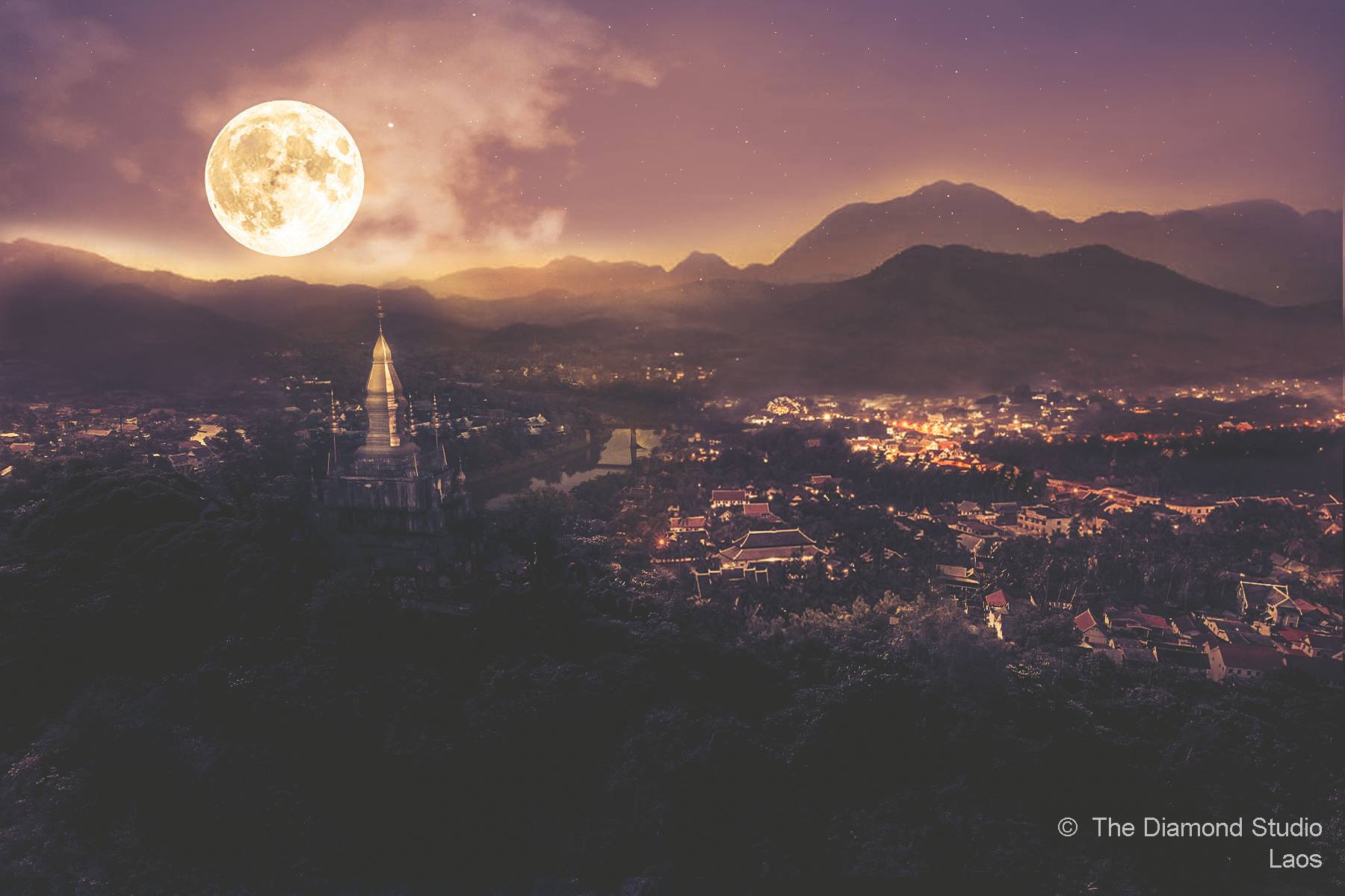 Moonlit view of Luang Prabang and temple stupa overlooking the historic city of the Lan Xang Kingdom, reflecting its sacred cultural landscape. Moonlit view of Luang Prabang and temple stupa overlooking the historic city of the Lan Xang Kingdom, reflecting its sacred cultural landscape.