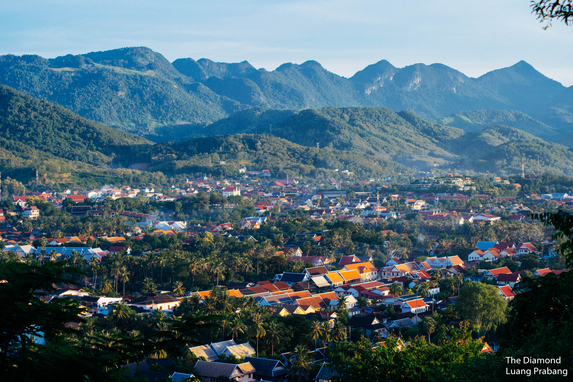 Luang Prabang UNESCO World Heritage city panorama with mountains and traditional rooftops in Laos Luang Prabang UNESCO World Heritage city panorama with mountains and traditional rooftops in Laos