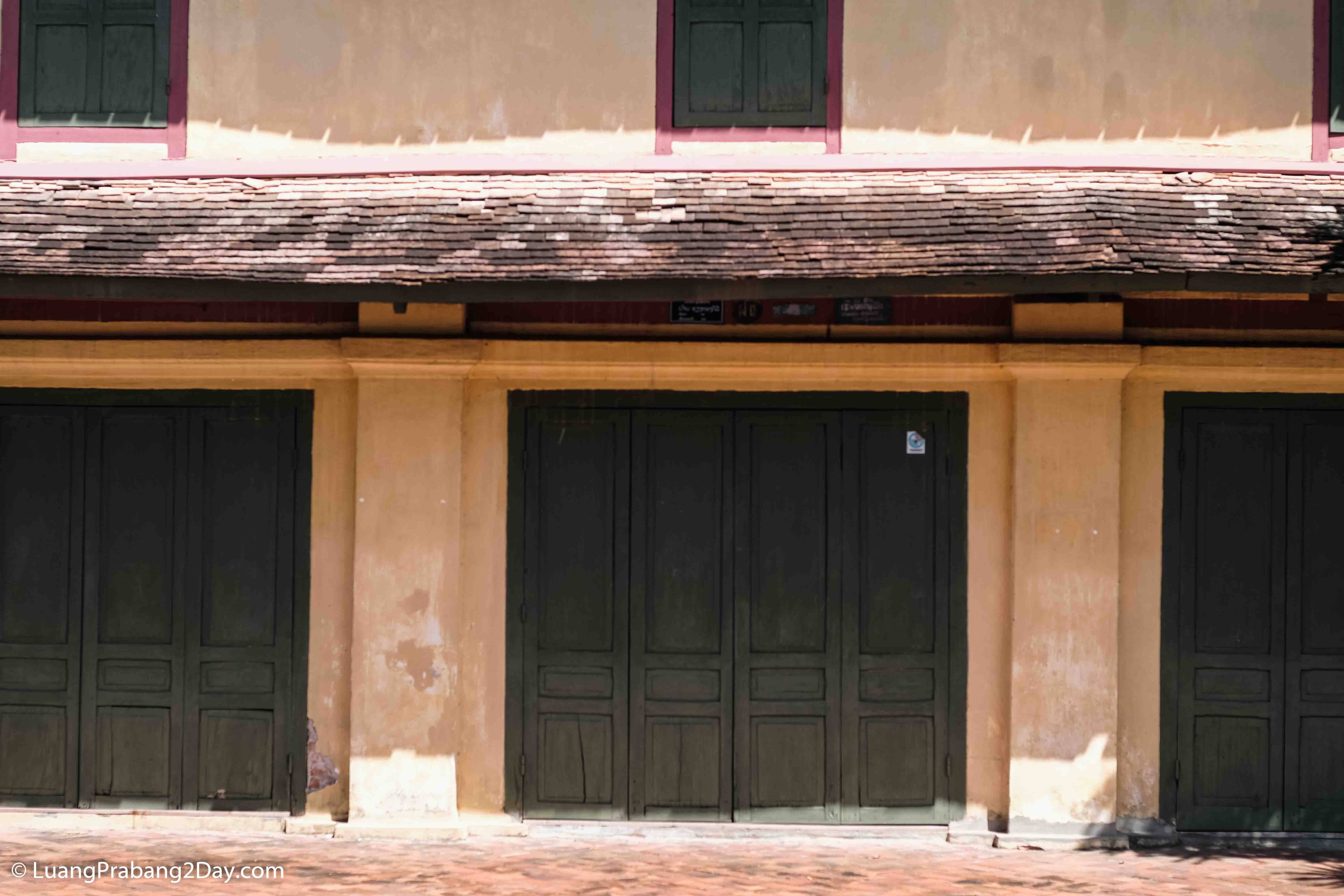 Traditional upper-story wooden window preserving the proportions of historic architecture in Luang Prabang. Traditional upper-story wooden window preserving the proportions of historic architecture in Luang Prabang.