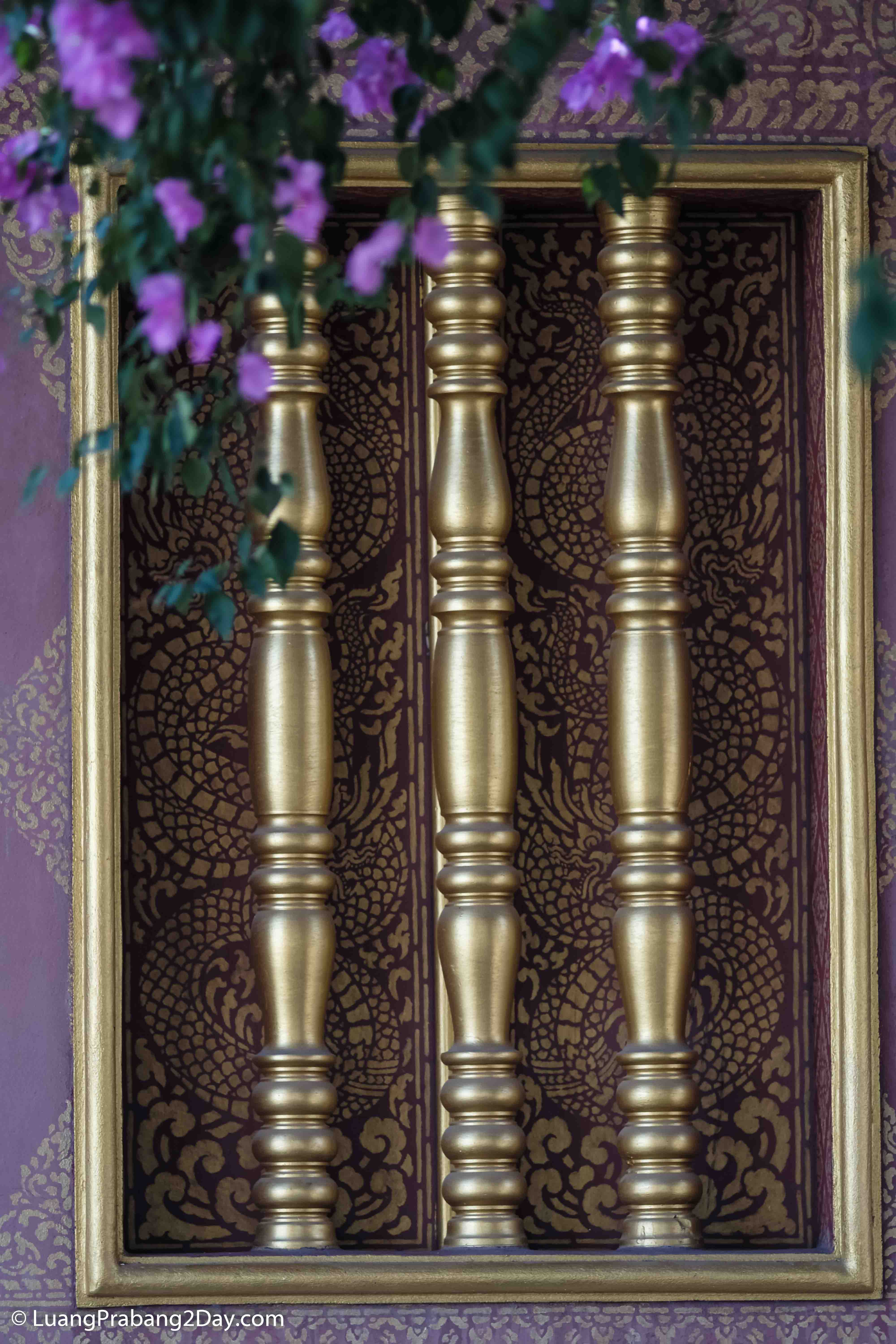 Gilded temple doors decorated with guardian figures and intricate Buddhist ornamentation in Luang Prabang. Gilded temple doors decorated with guardian figures and intricate Buddhist ornamentation in Luang Prabang.