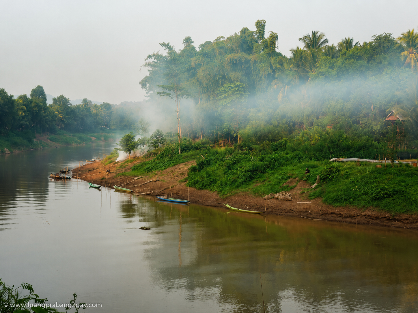 Morning mist rising above the Mekong River near Luang Prabang Laos Morning mist rising above the Mekong River near Luang Prabang Laos