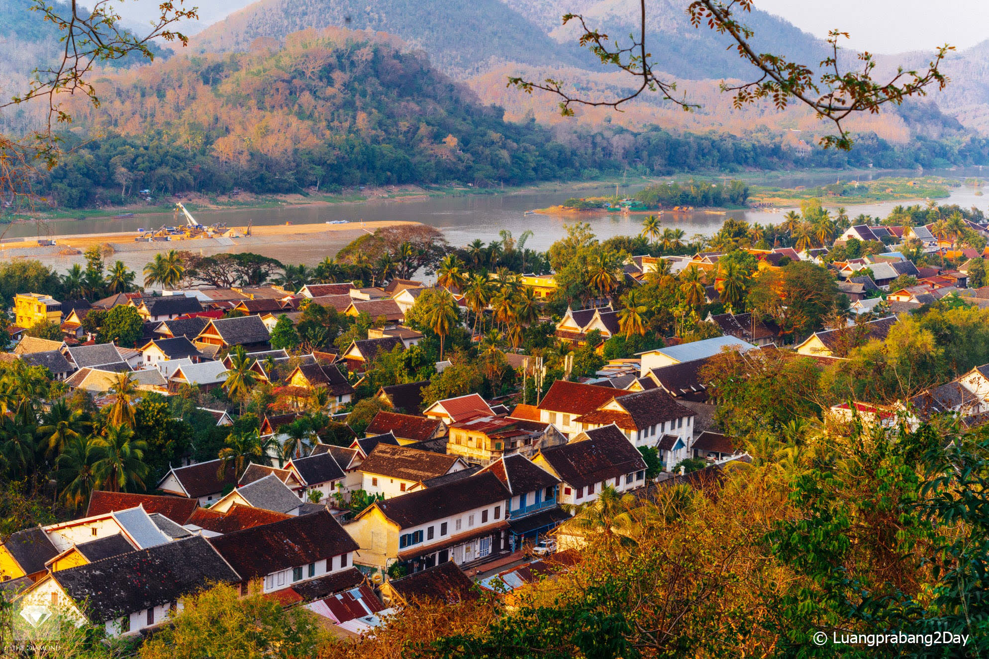 Panoramic view of Luang Prabang surrounded by the Mekong River and mountains during golden hour in Laos Panoramic view of Luang Prabang surrounded by the Mekong River and mountains during golden hour in Laos