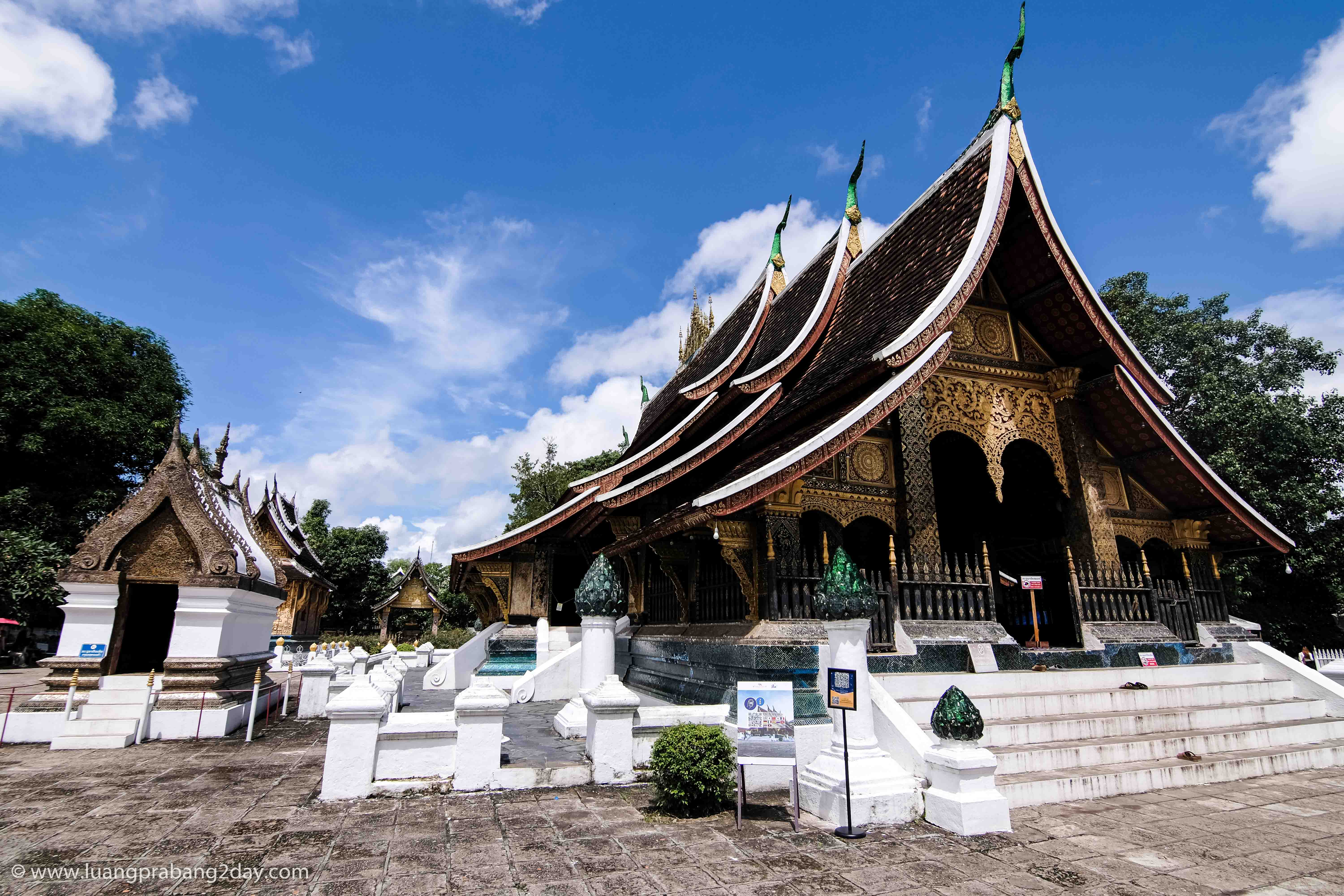 Front view of Wat Xieng Thong displaying its multi-tiered roof and richly decorated façade. Front view of Wat Xieng Thong displaying its multi-tiered roof and richly decorated façade.