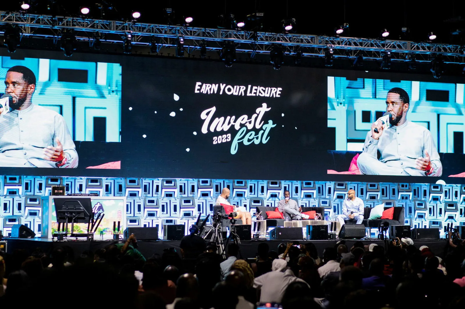 High-quality image capturing a dynamic moment between key music industry figures at a festival event, conveying modern marketing energy.