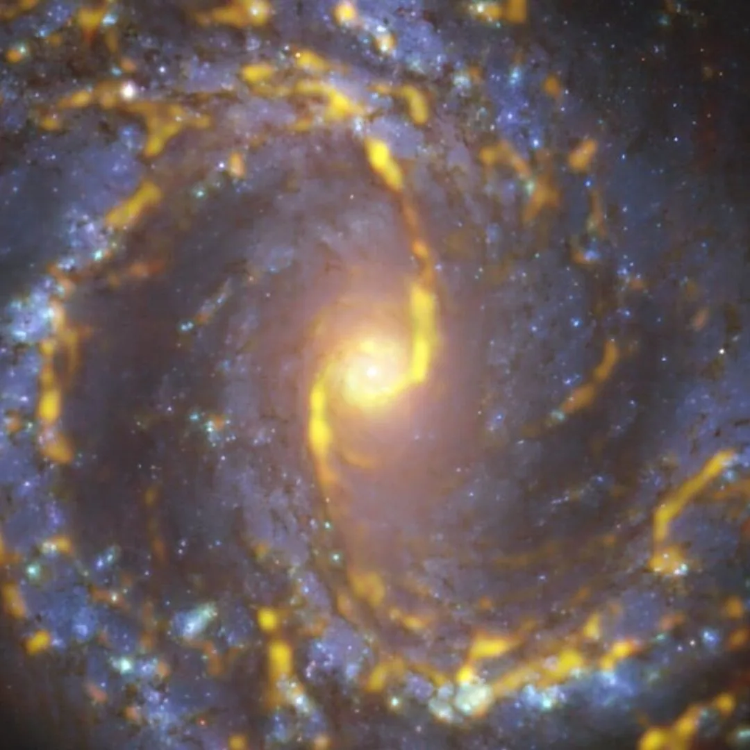 Crisp and colorful image of NGC 6000 highlighting its glowing stellar arms and dust lanes as seen from Hubble.
