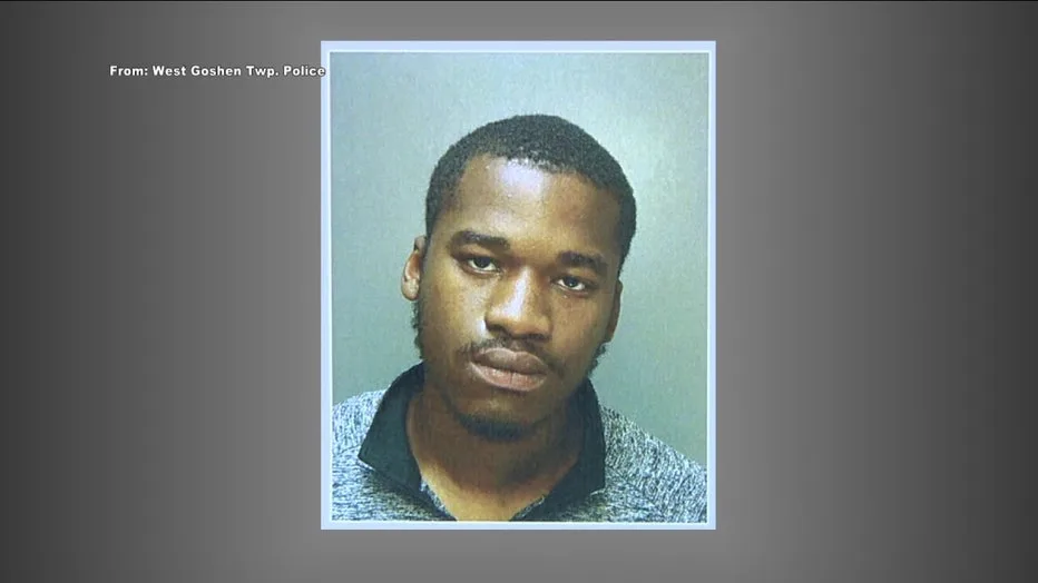 Still image from surveillance footage depicting a robbery suspect on the scene, relevant to the incident coverage.