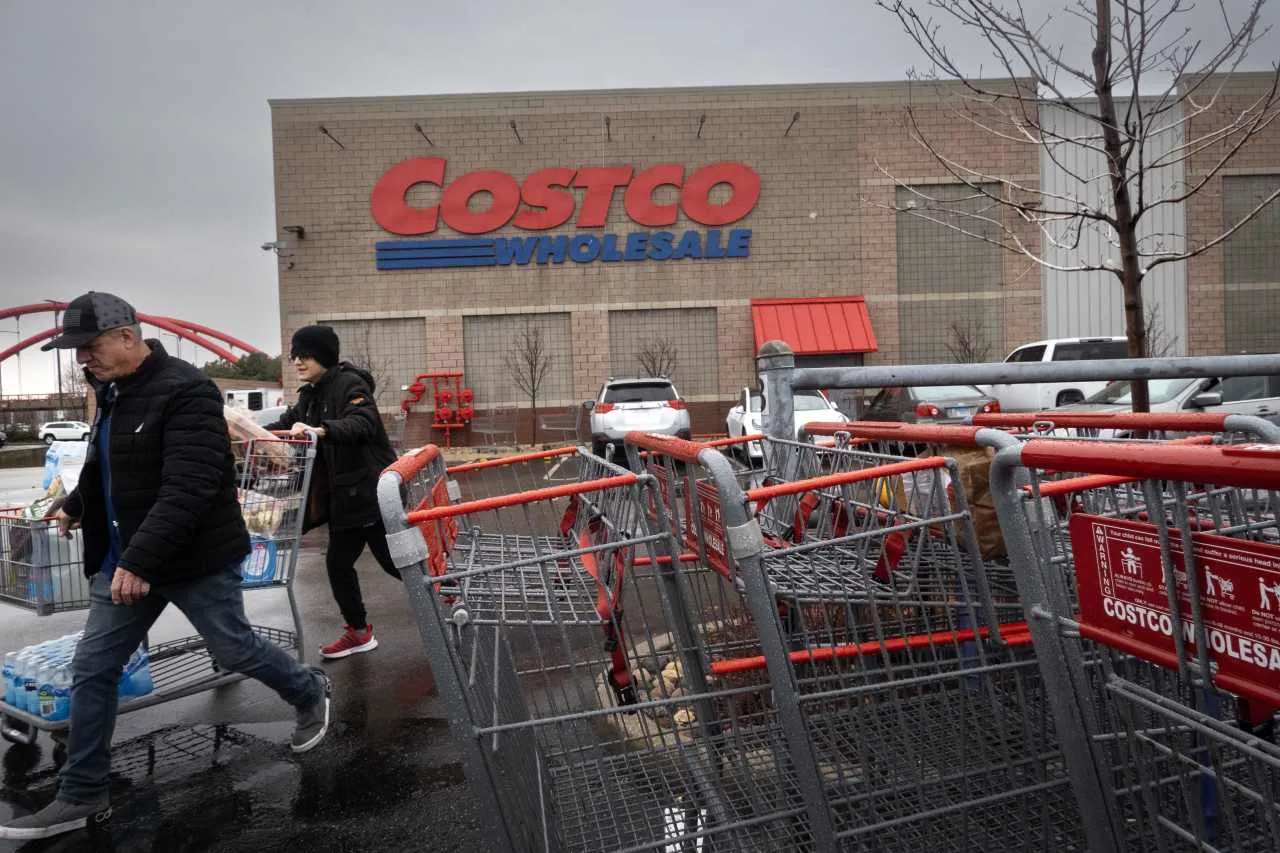 High-quality image of Costco Wholesale store with customers, representing retail activity and foot traffic.