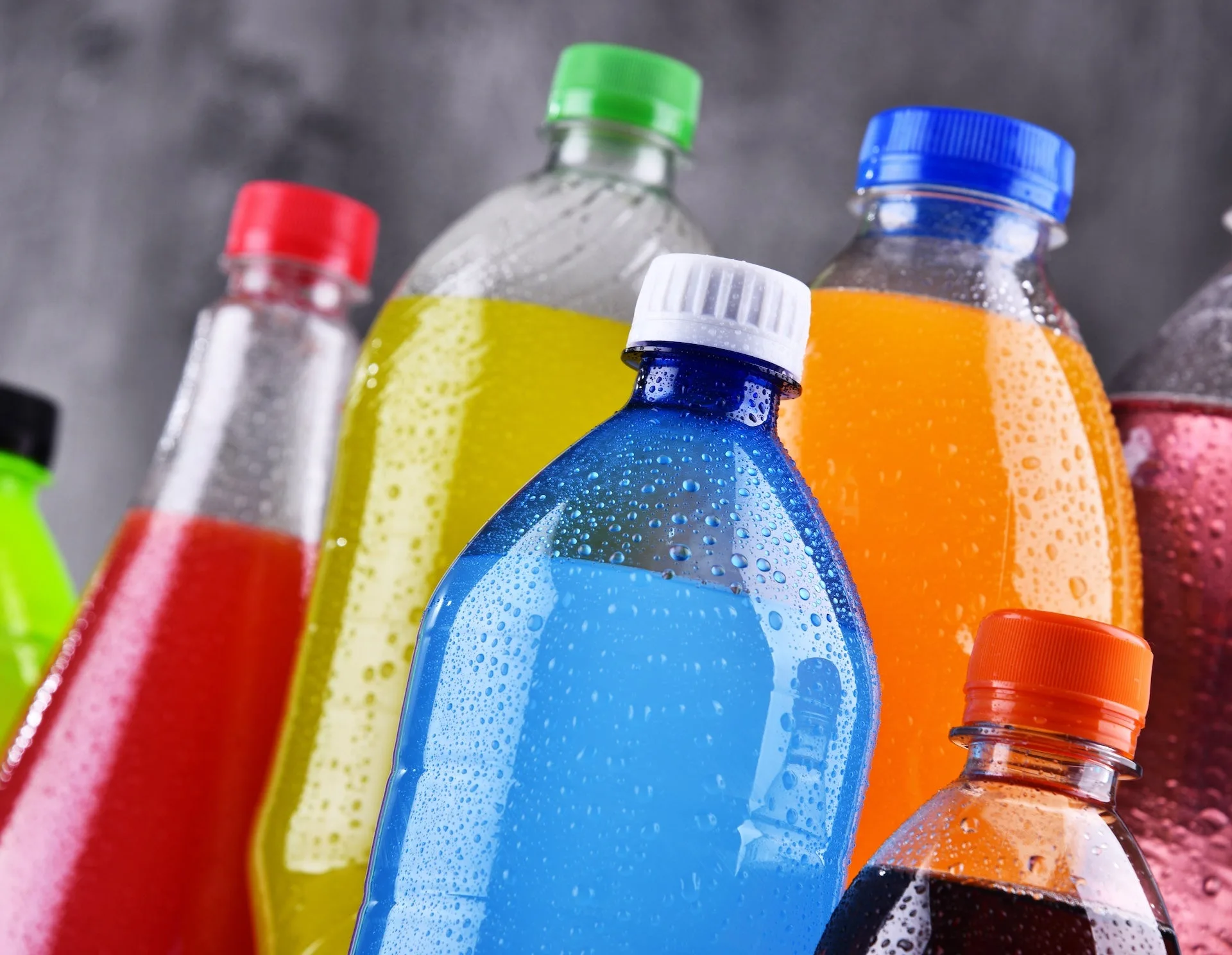 High-quality image showing various sugary drinks, highlighting the subject of sugar consumption and its health impact.