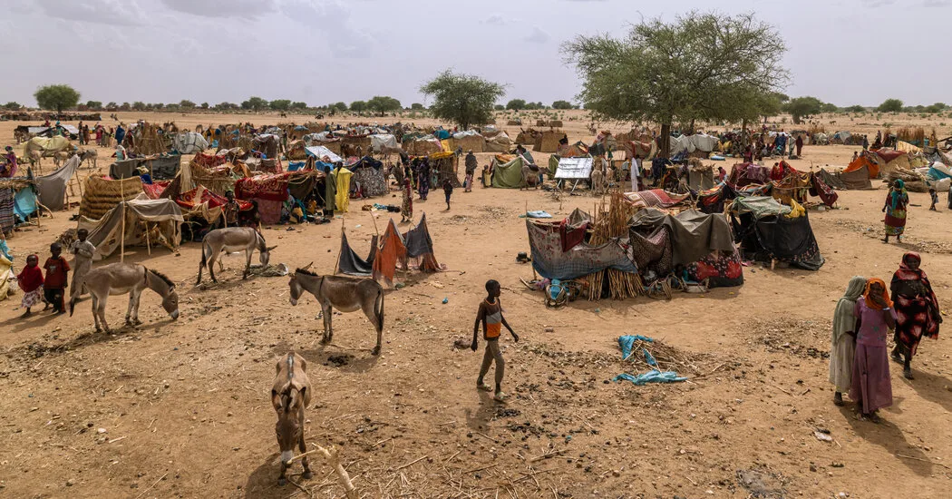 Sudanese refugees gather in eastern Chad after fleeing intensifying violence. The photo captures the expanse of the humanitarian situation along the border.