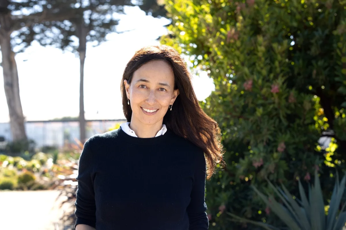 High quality professional portrait of Mariam Naficy, founder of Minted, with a softly blurred outdoor background, suitable for business and leadership profiles.